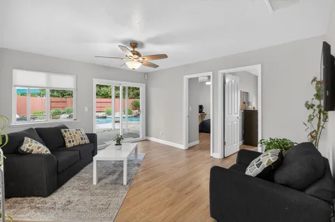 a living room with furniture and a large window