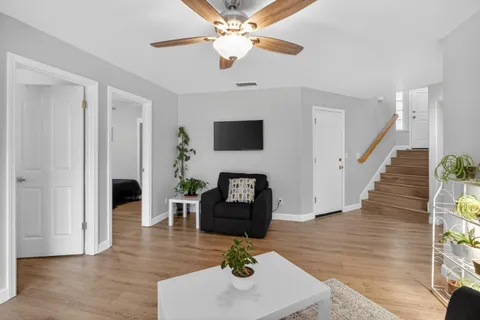 a living room with furniture and a fireplace