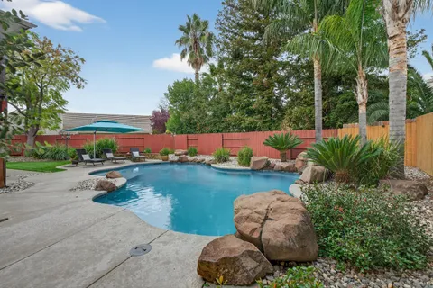 an aerial view of a house with outdoor space