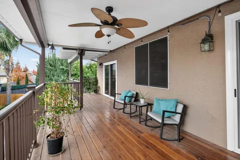 a view of two chairs in the balcony