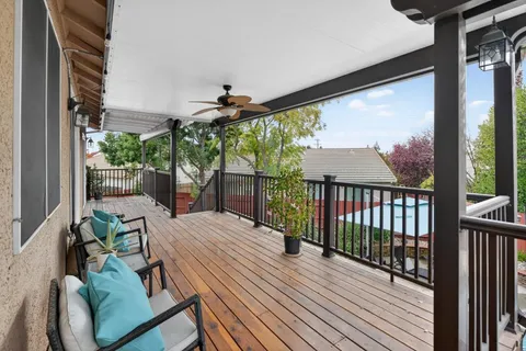 a view of a balcony with furniture