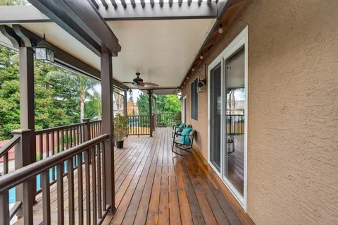 a view of balcony with wooden floor