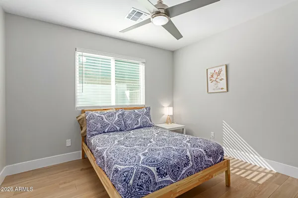 a bedroom with a bed and window