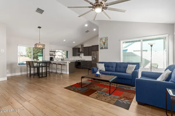 a living room with furniture and a large window