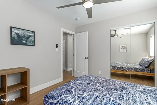 a bedroom with bed and window