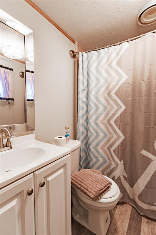 4705 Fox Hollow Road, Unit 30 Graham, TX 76450 - Photo 15 of 31 a bathroom with a sink and toilet