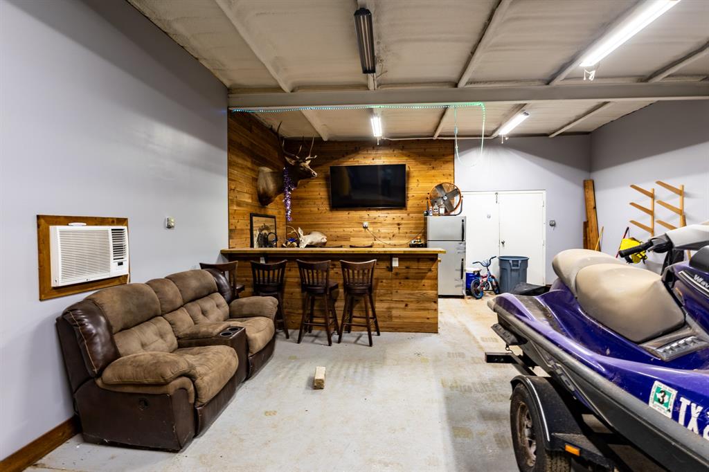 4705 Fox Hollow Road, Unit 30 Graham, TX 76450 - Photo 19 of 31 a living room with furniture and a flat screen tv