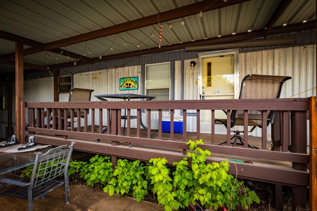 4705 Fox Hollow Road, Unit 30 Graham, TX 76450 - Photo 3 of 31 a view of a chairs and table in the patio