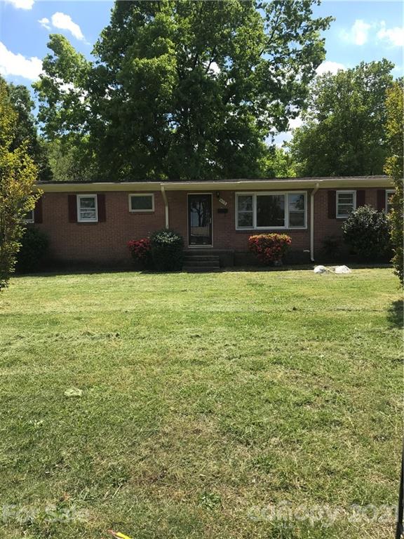 a front view of a house with yard