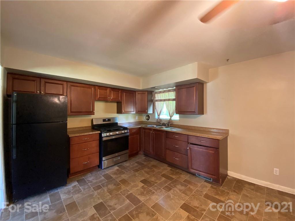 612 Jennings Road Rock Hill, SC 29730 - Photo 14 of 27 a kitchen with stainless steel appliances granite countertop a refrigerator and a stove top oven