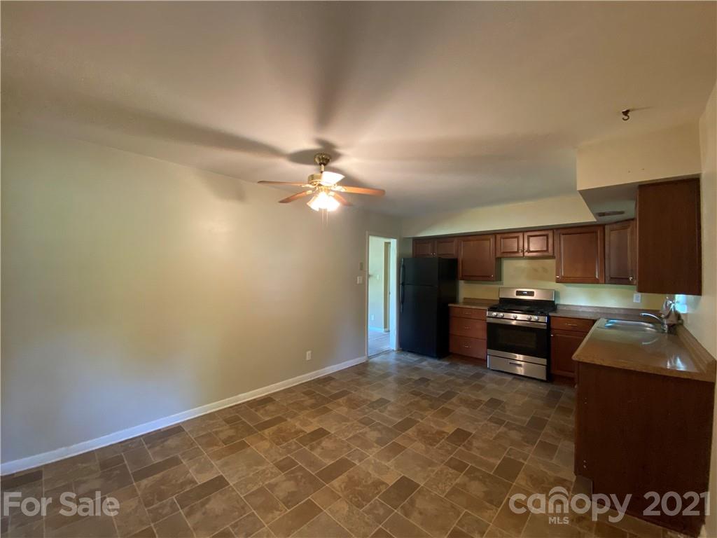 612 Jennings Road Rock Hill, SC 29730 - Photo 17 of 27 a kitchen with granite countertop a sink cabinets and stainless steel appliances