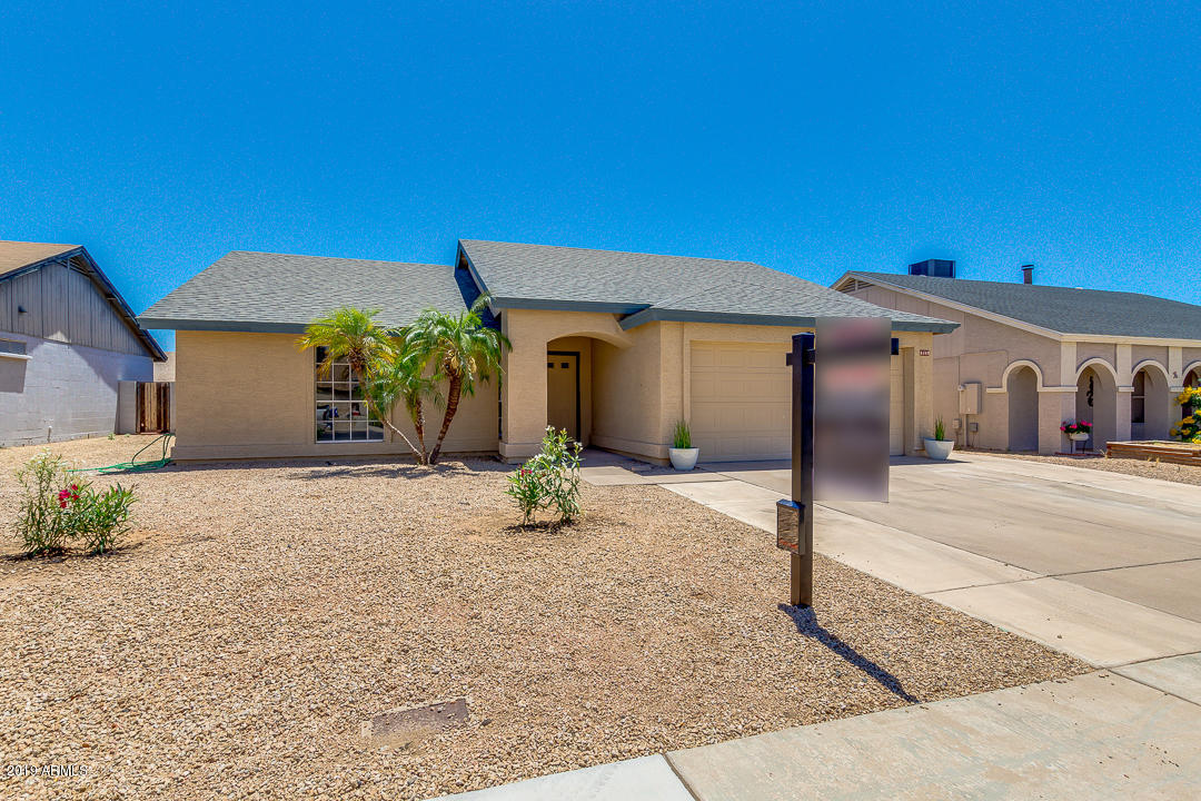 6149 Casper Road Mesa, AZ 85205 - Photo 1 of 21 a front view of a house with a yard