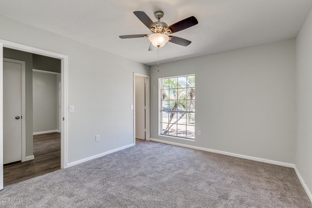 6149 Casper Road Mesa, AZ 85205 - Photo 13 of 21 Bedroom 2 w/ new carpet & fan