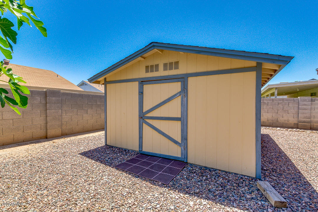 6149 Casper Road Mesa, AZ 85205 - Photo 19 of 21 a view of wooden house with a wooden fence