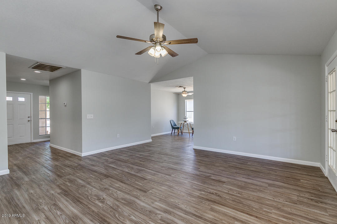 6149 Casper Road Mesa, AZ 85205 - Photo 4 of 21 a view of a livingroom with wooden floor
