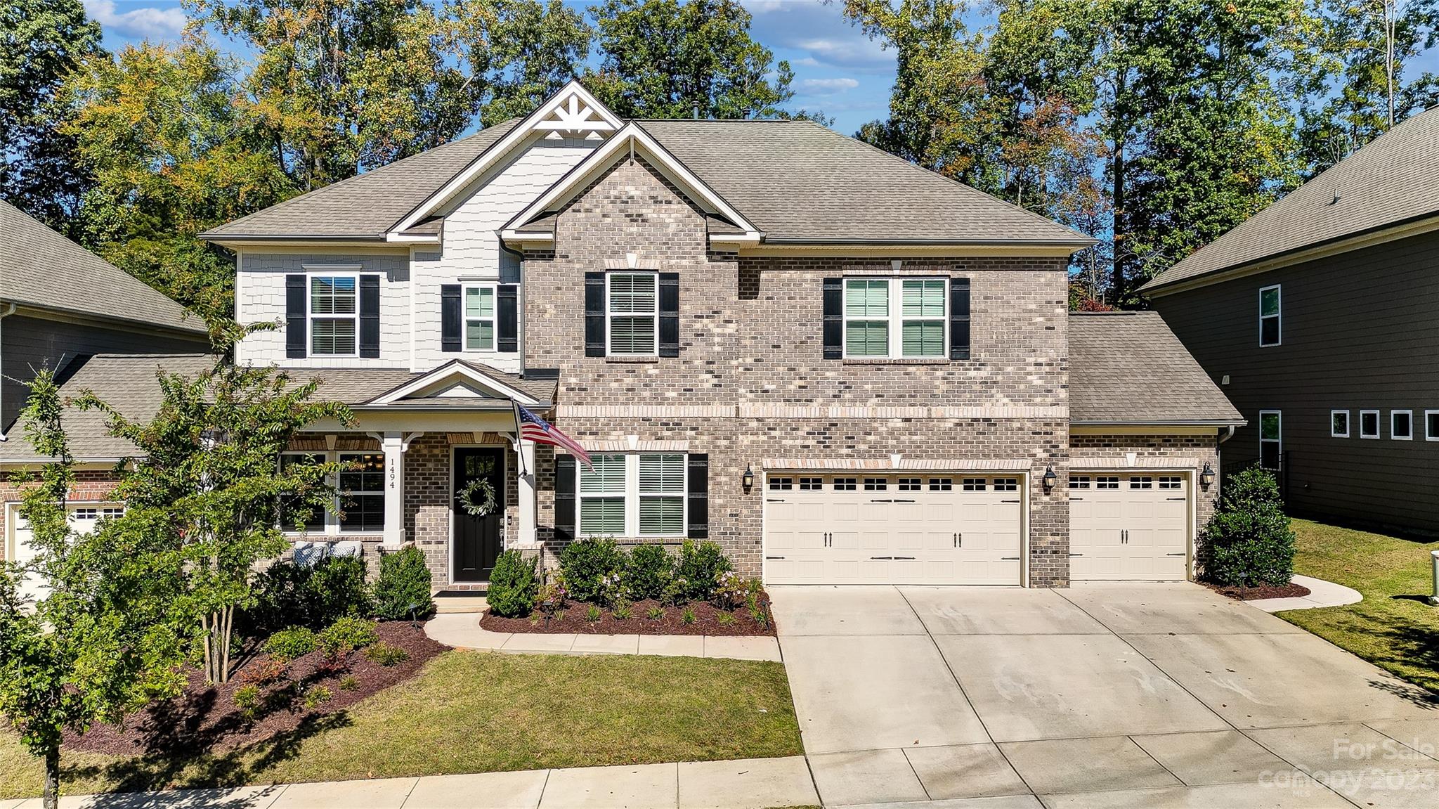 1494 Afton Way Fort Mill, SC 29708 - Photo 1 of 47 a view of a white house with a small yard and large trees