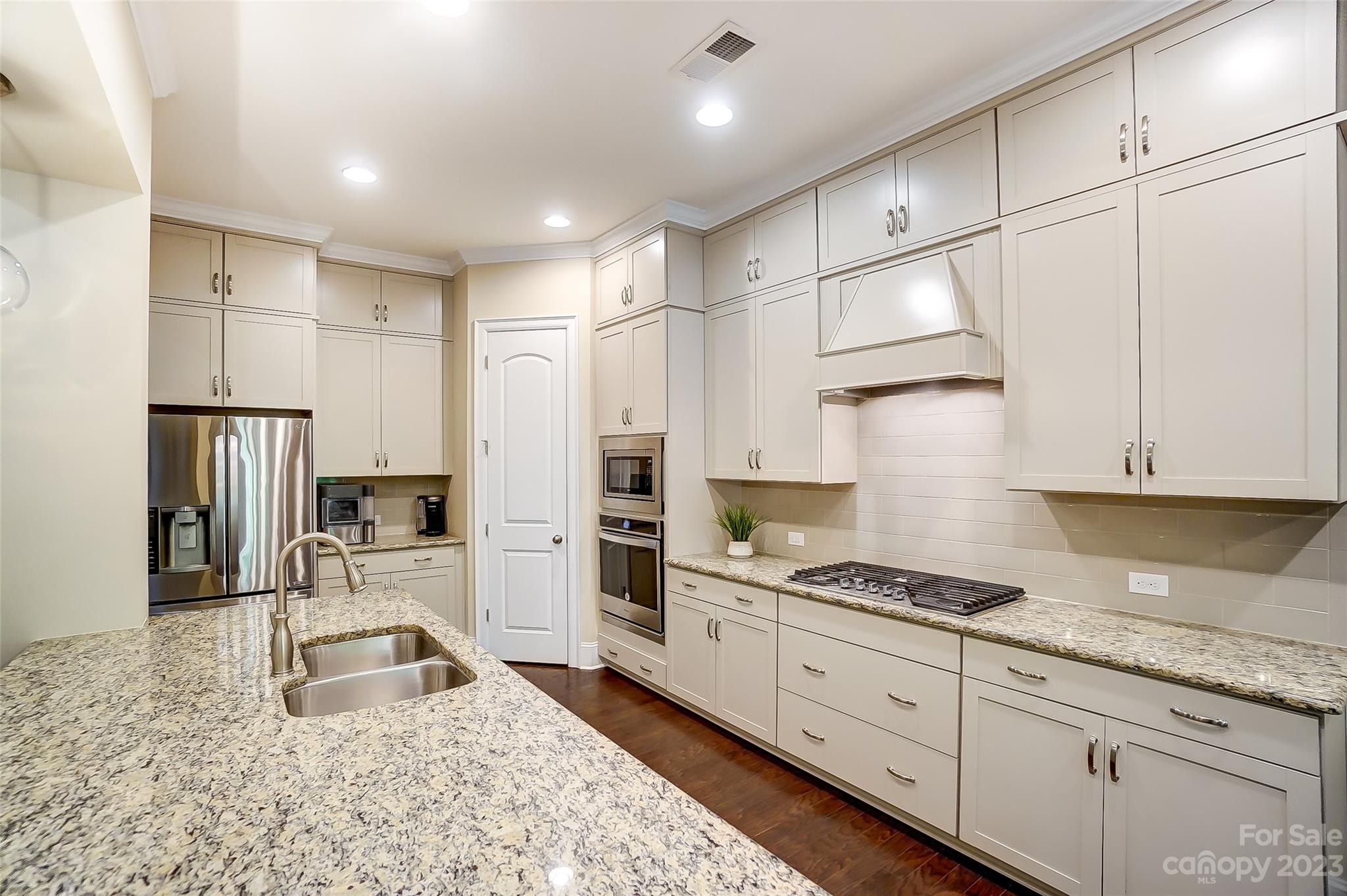 1494 Afton Way Fort Mill, SC 29708 - Photo 13 of 47 a kitchen with granite countertop a sink stainless steel appliances and cabinets