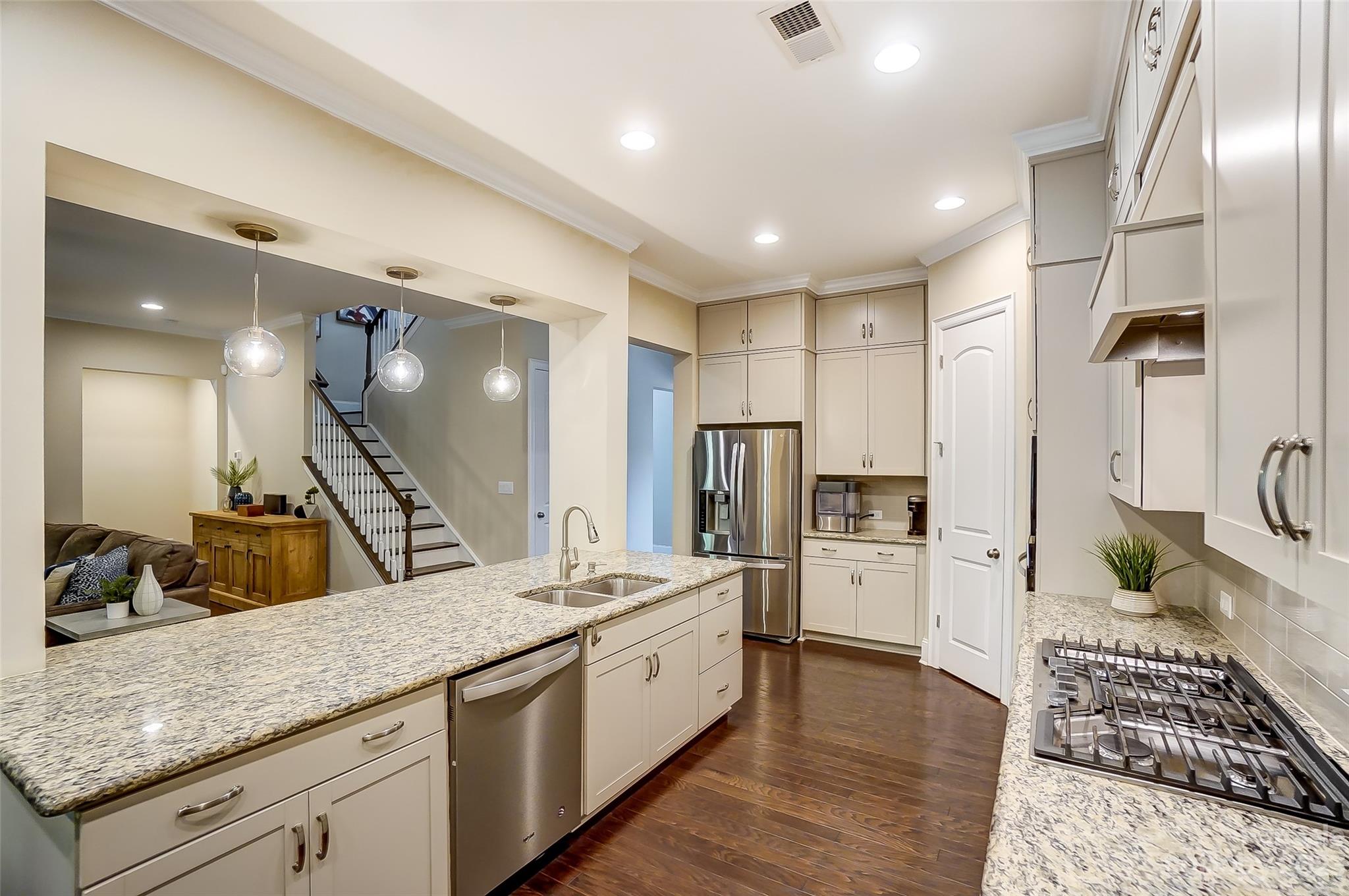 1494 Afton Way Fort Mill, SC 29708 - Photo 14 of 47 a large kitchen with stainless steel appliances kitchen island granite countertop a refrigerator and a sink