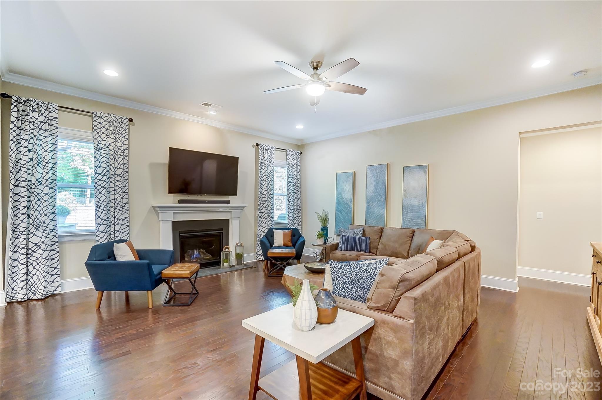 1494 Afton Way Fort Mill, SC 29708 - Photo 16 of 47 a living room with furniture a fireplace and a flat screen tv