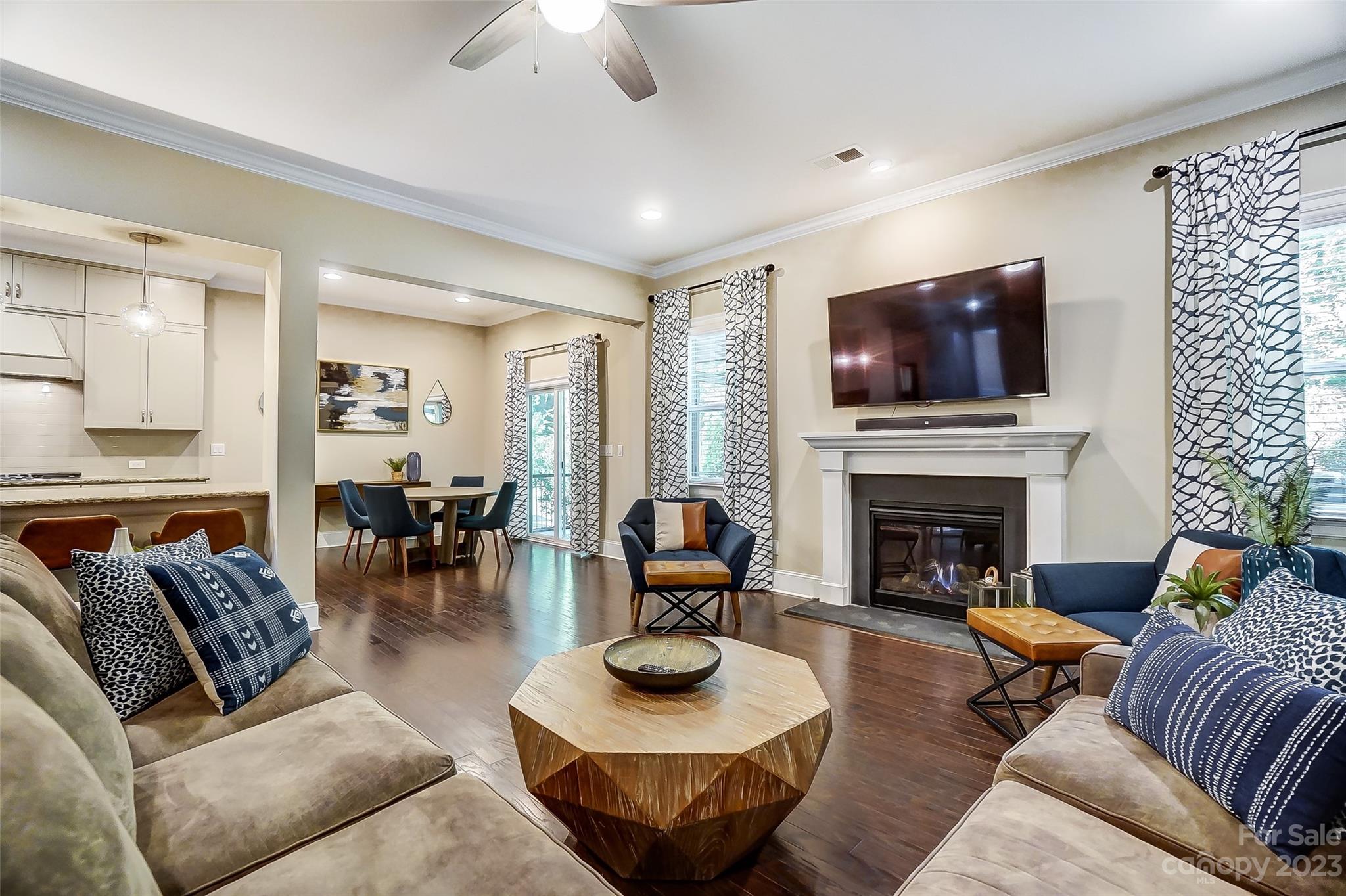 1494 Afton Way Fort Mill, SC 29708 - Photo 17 of 47 a living room with furniture a fireplace and a flat screen tv