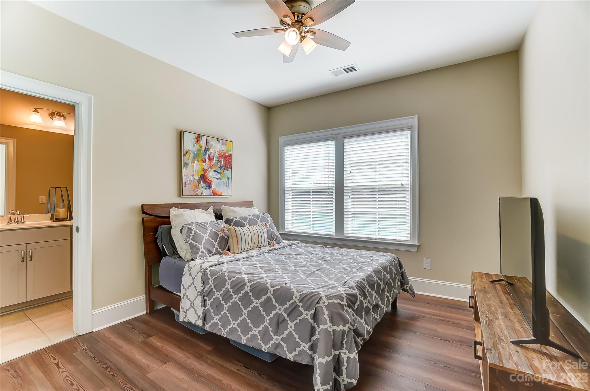 1494 Afton Way Fort Mill, SC 29708 - Photo 27 of 47 a bedroom with a bed and a flat screen tv