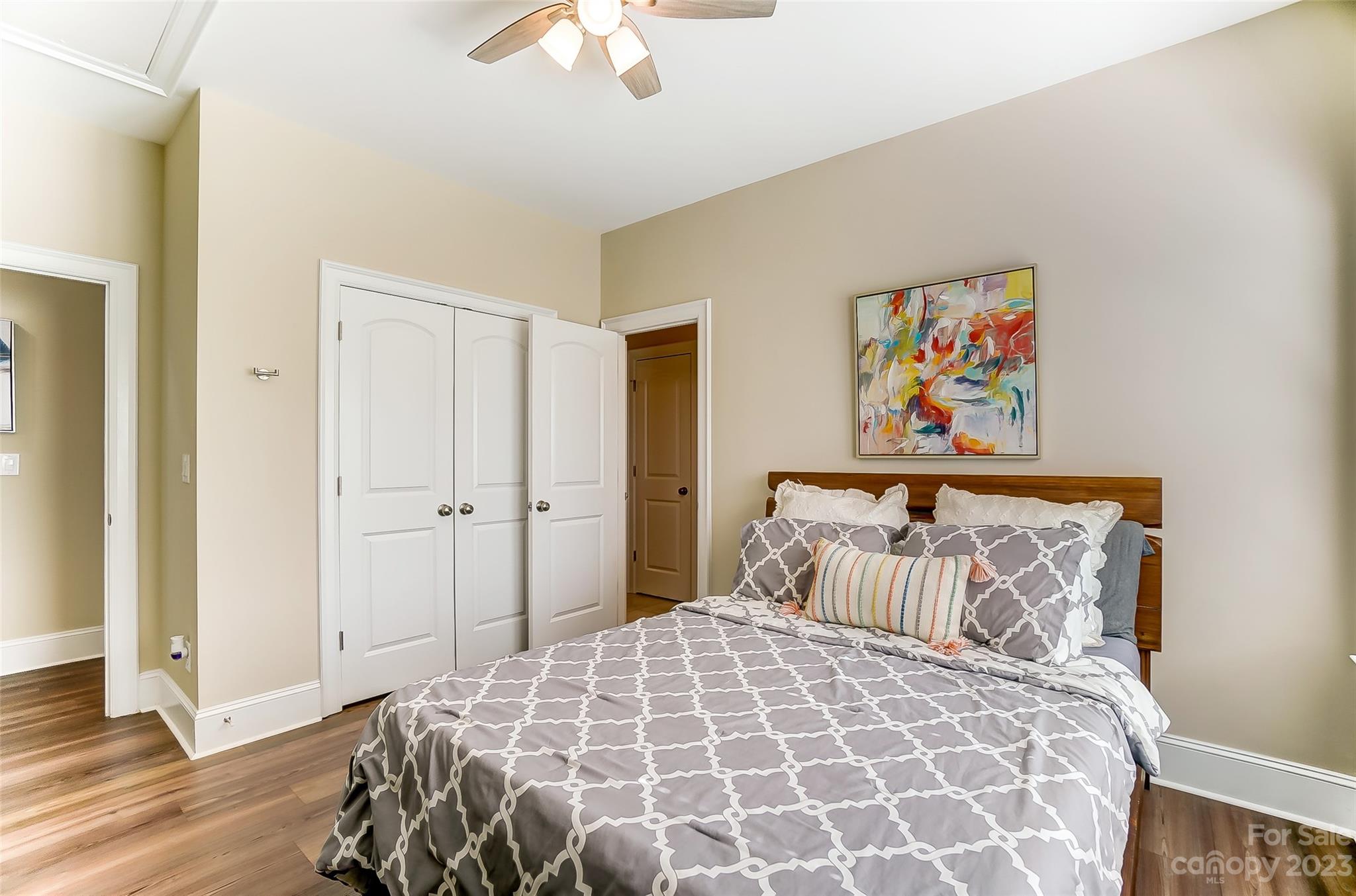 1494 Afton Way Fort Mill, SC 29708 - Photo 28 of 47 a bedroom with a bed and a painting on the wall