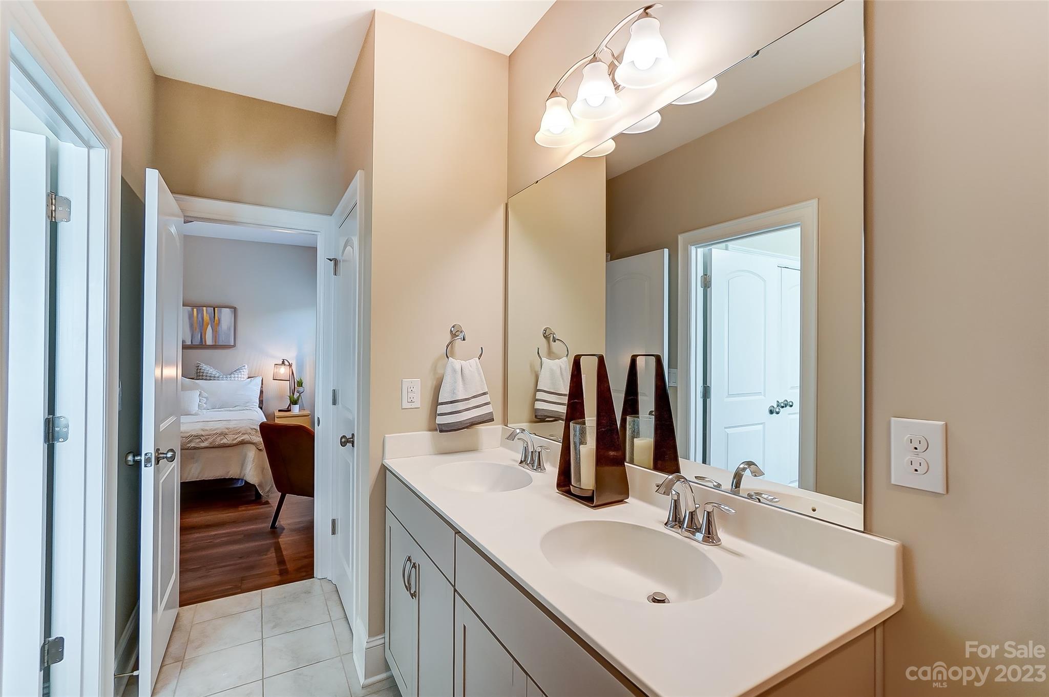 1494 Afton Way Fort Mill, SC 29708 - Photo 30 of 47 a en suite bathroom with a double vanity sink and a mirror