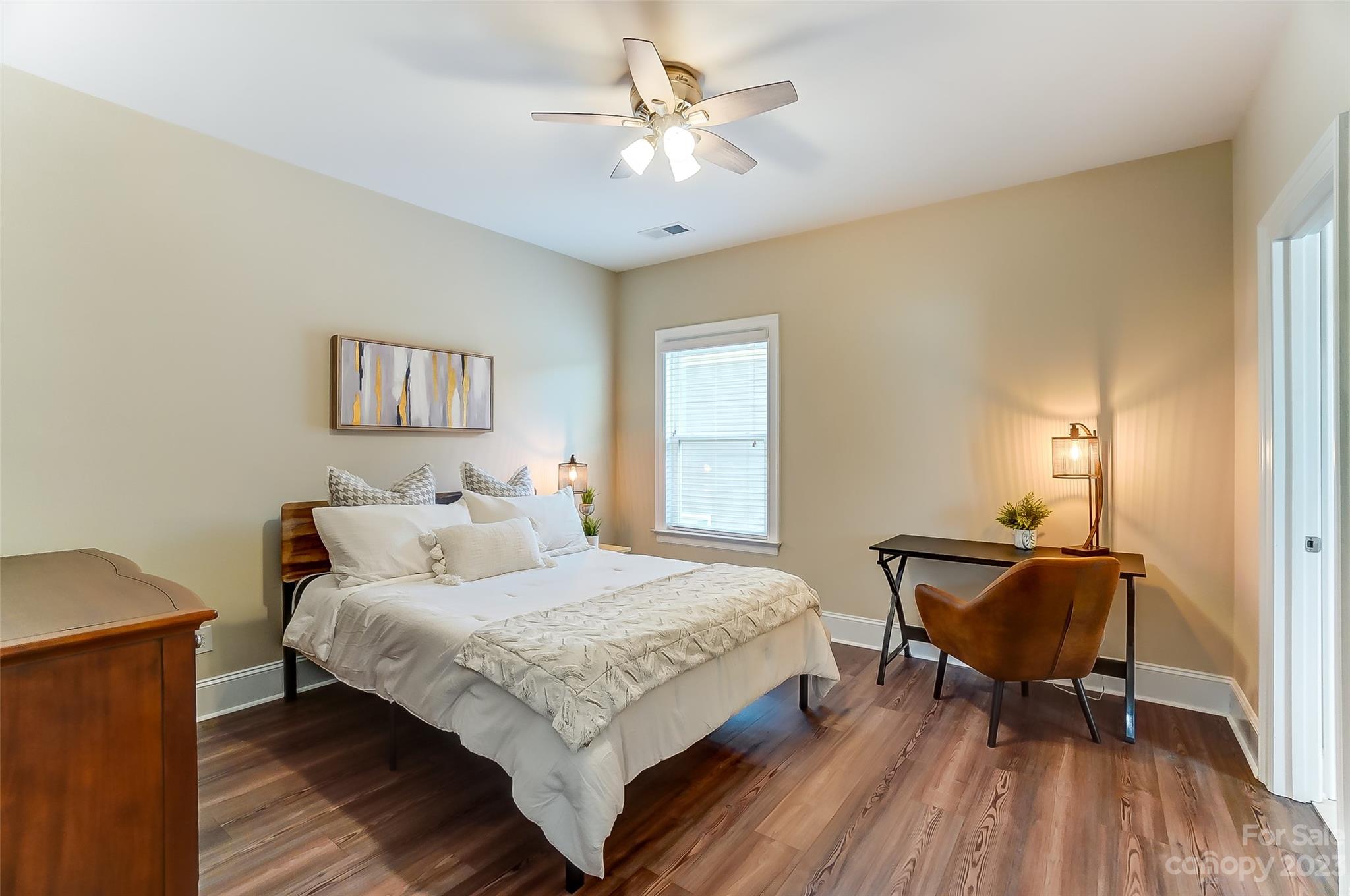 1494 Afton Way Fort Mill, SC 29708 - Photo 32 of 47 a bedroom with a bed and a chandelier