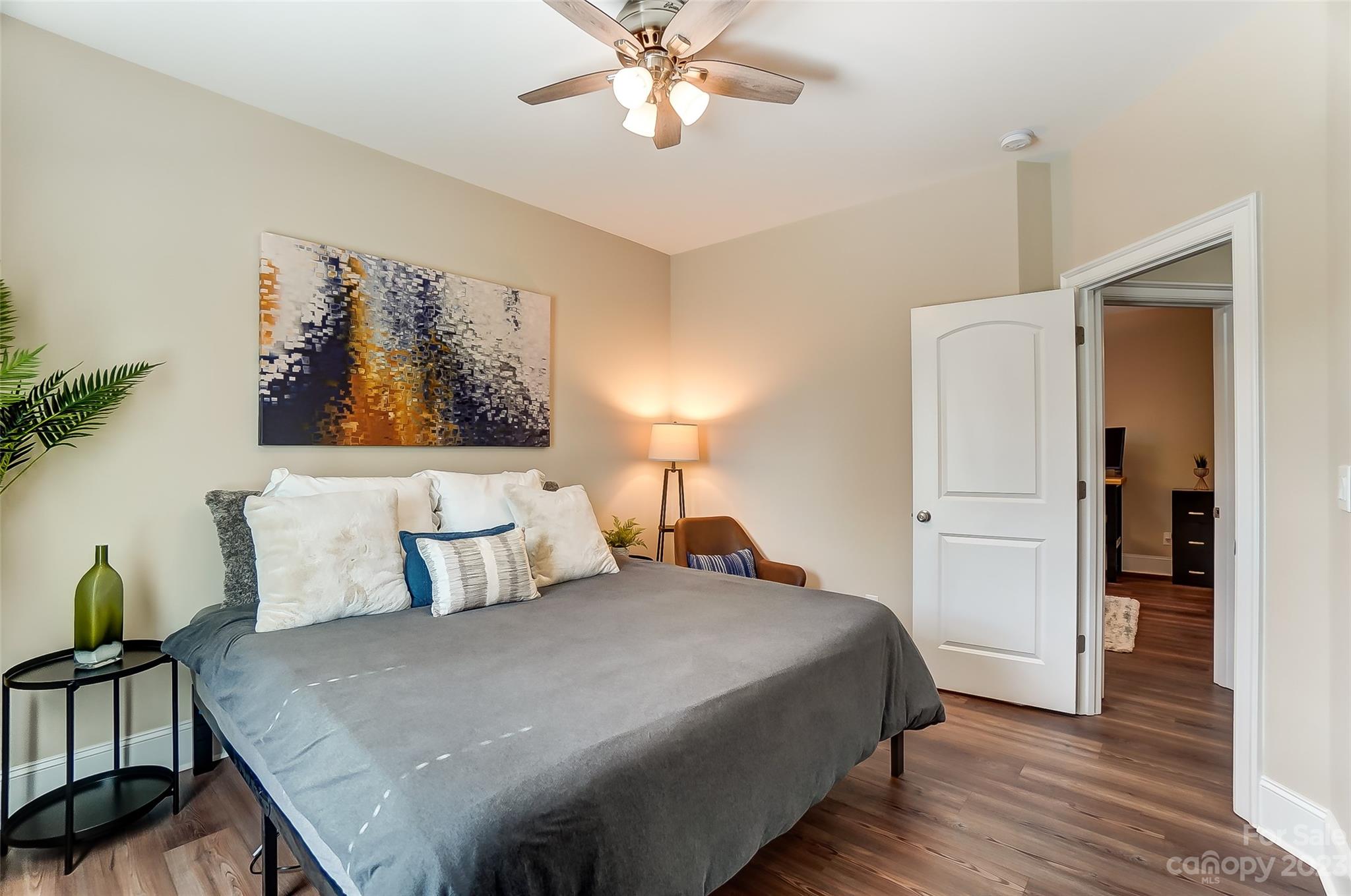 1494 Afton Way Fort Mill, SC 29708 - Photo 34 of 47 a bedroom with a bed and a chandelier