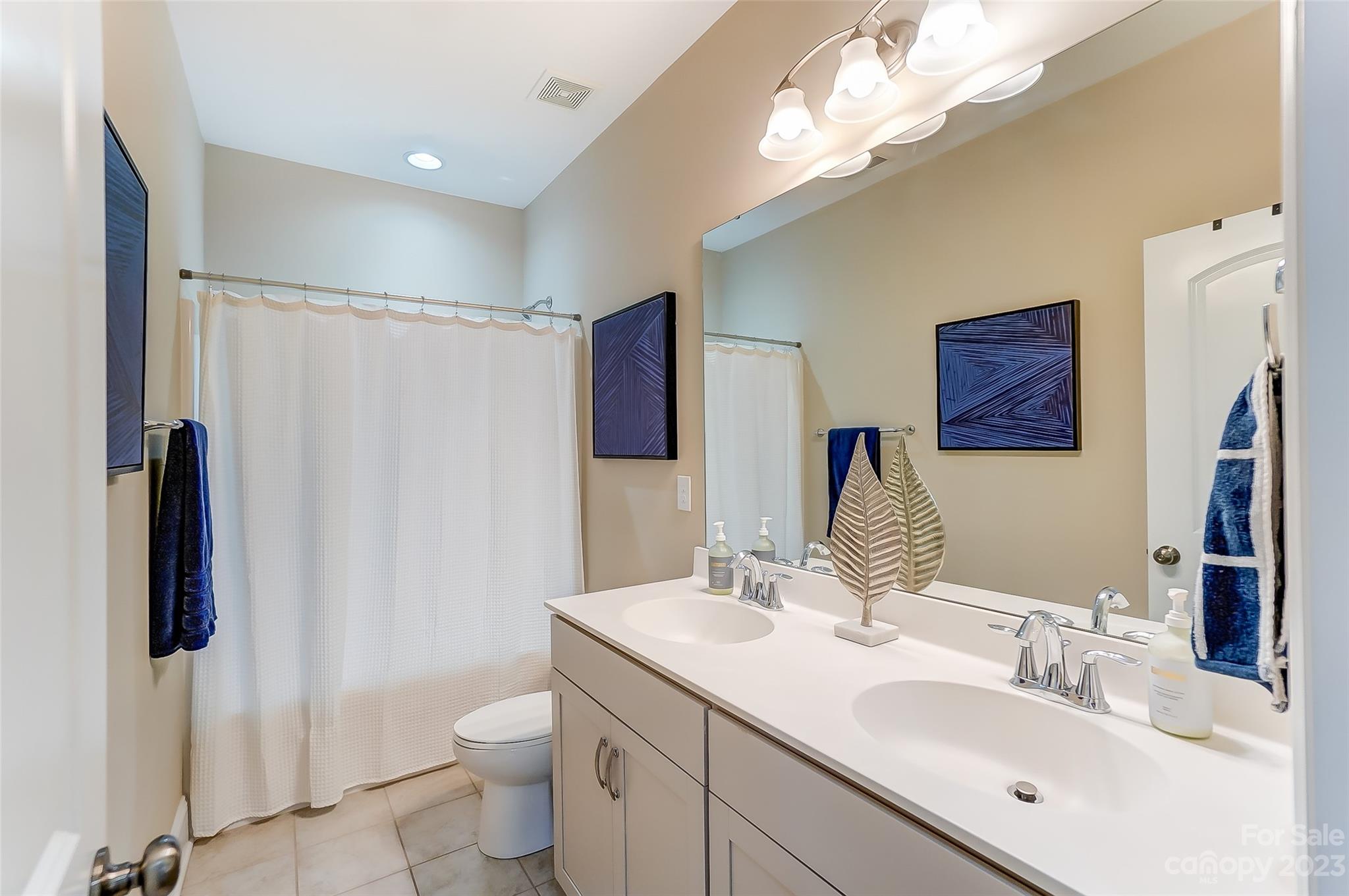 1494 Afton Way Fort Mill, SC 29708 - Photo 35 of 47 a bathroom with a double vanity sink and mirror