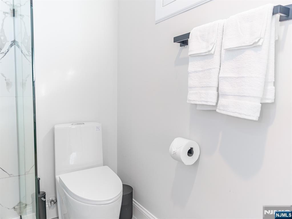 21 Skyview Road Ringwood, NJ 07456 - Photo 11 of 49 a bathroom with a toilet and a shower