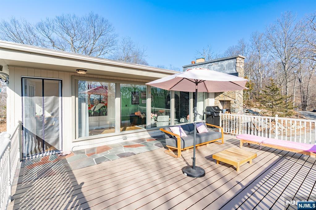 21 Skyview Road Ringwood, NJ 07456 - Photo 16 of 49 a view of balcony with wooden floor and outdoor seating