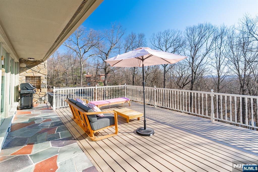 21 Skyview Road Ringwood, NJ 07456 - Photo 19 of 49 a view of a roof deck with wooden floor and yard