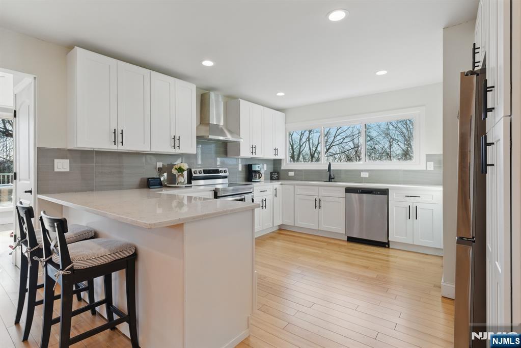 21 Skyview Road Ringwood, NJ 07456 - Photo 25 of 49 a kitchen with a sink window and cabinets