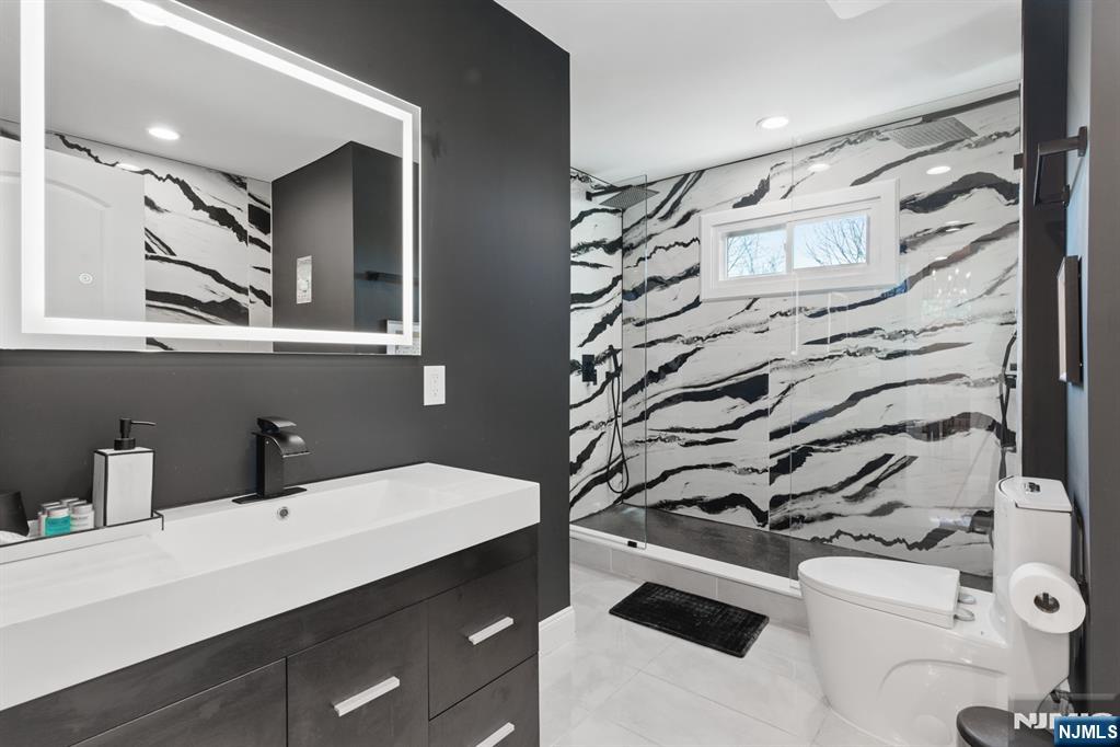 21 Skyview Road Ringwood, NJ 07456 - Photo 29 of 49 a bathroom with a sink and a mirror