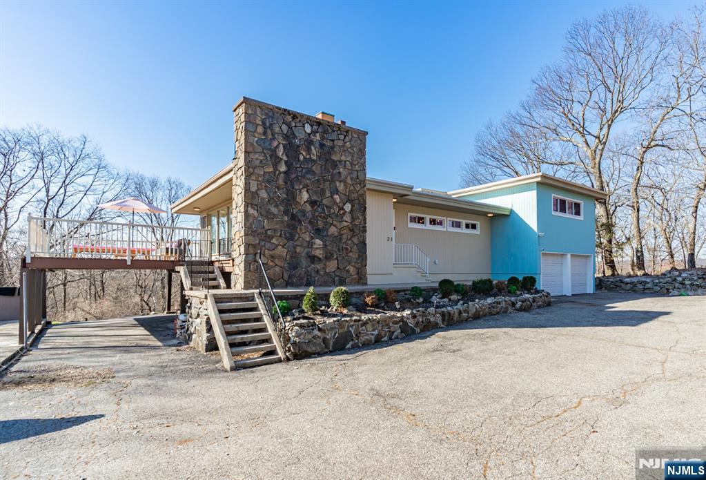 21 Skyview Road Ringwood, NJ 07456 - Photo 3 of 49 a front view of a house with parking