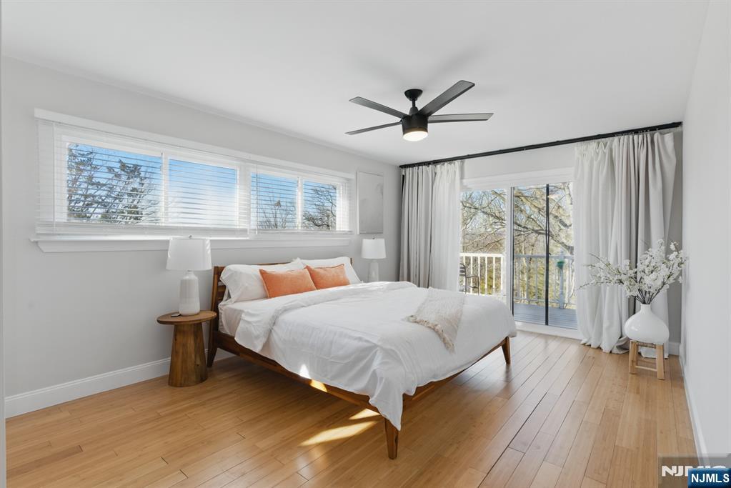 21 Skyview Road Ringwood, NJ 07456 - Photo 32 of 49 a bedroom with a large bed and a large window