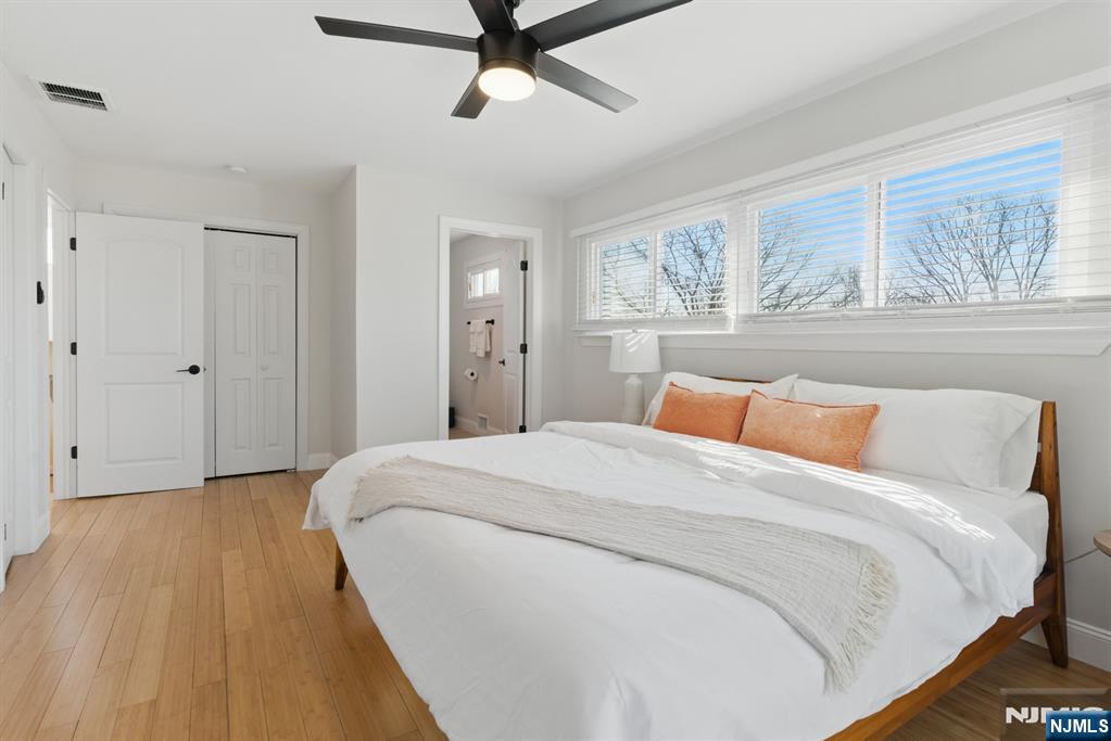 21 Skyview Road Ringwood, NJ 07456 - Photo 34 of 49 a bed room with a bed and a painting on the wall