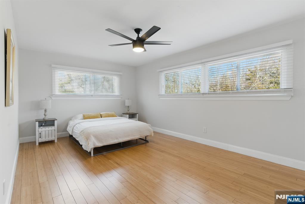 21 Skyview Road Ringwood, NJ 07456 - Photo 40 of 49 a bedroom with a bed and wooden floor