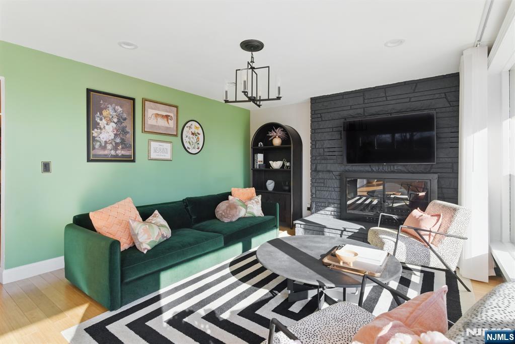 21 Skyview Road Ringwood, NJ 07456 - Photo 44 of 49 a living room with furniture and wooden floor