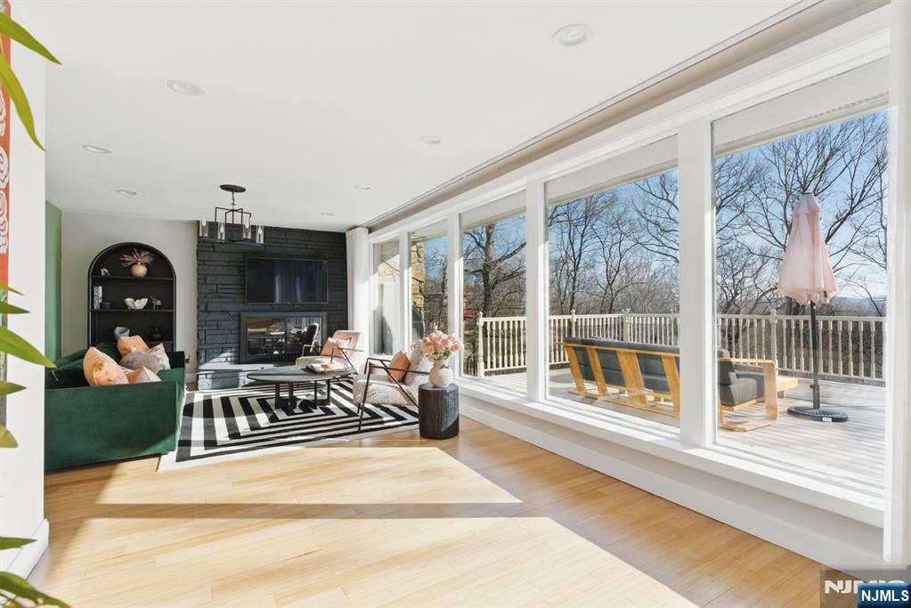 21 Skyview Road Ringwood, NJ 07456 - Photo 45 of 49 a living room with furniture a floor to ceiling window and floor to ceiling window