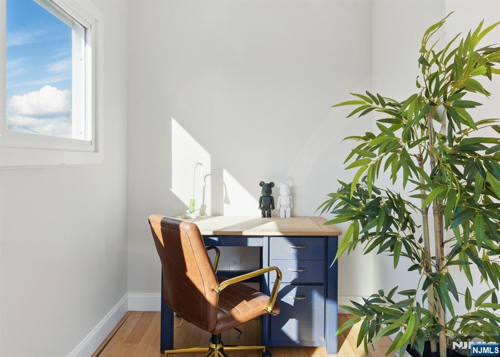 21 Skyview Road Ringwood, NJ 07456 - Photo 47 of 49 a view of a dining room with furniture and a potted plant