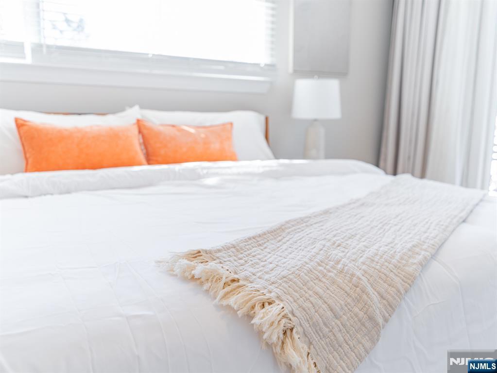 21 Skyview Road Ringwood, NJ 07456 - Photo 9 of 49 a bedroom with a bed and window