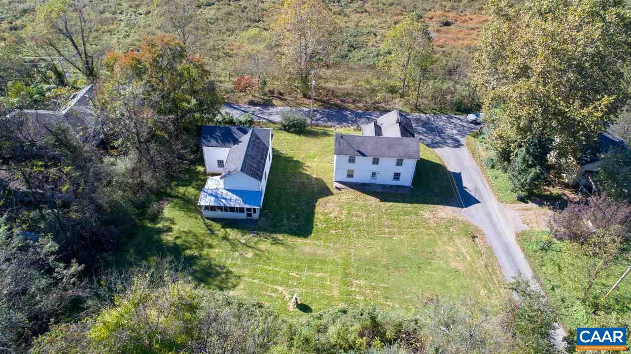 7595 Esmont Road Esmont, VA 22937 - Photo 25 of 30 an aerial view of a house with swimming pool and large trees