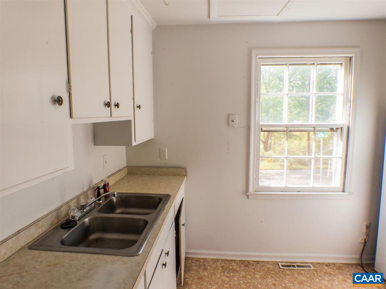 7595 Esmont Road Esmont, VA 22937 - Photo 9 of 30 a kitchen that has a sink and a stove