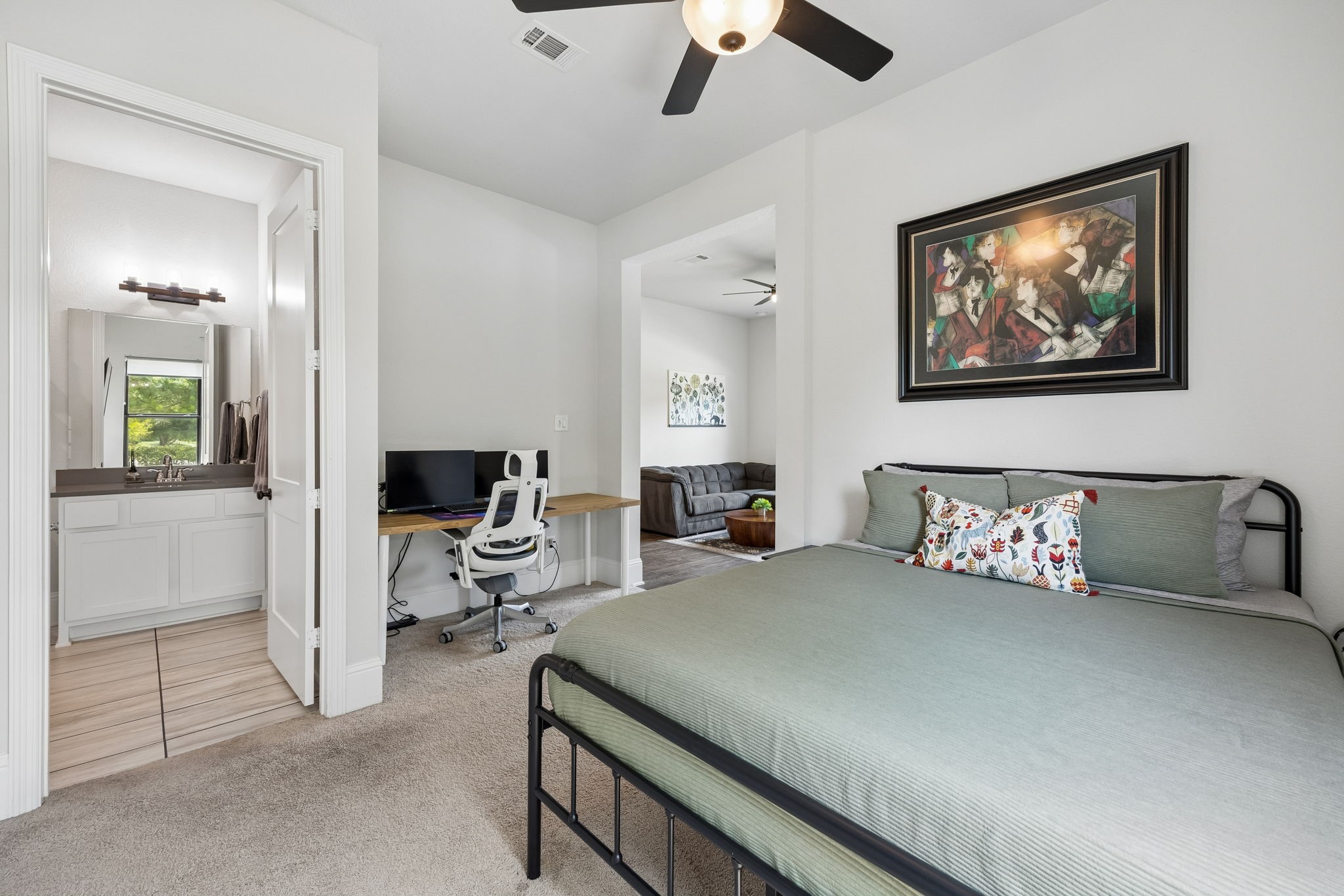 10102 South Goshawk Trail Conroe, TX 77385 - Photo 16 of 46 a bedroom with furniture and a large window
