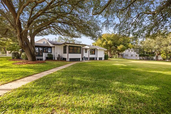a view of a house with a yard