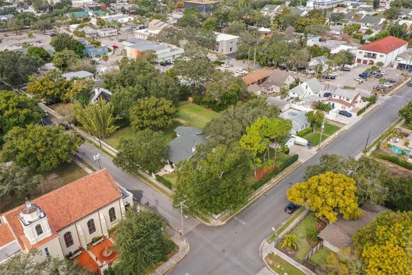 an aerial view of a house with a yard