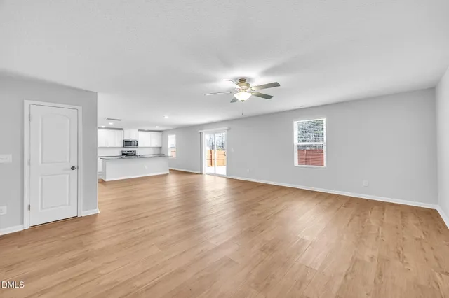 a spacious bedroom with a bed and a couch