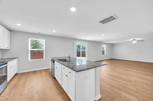 a view of an empty room with a window